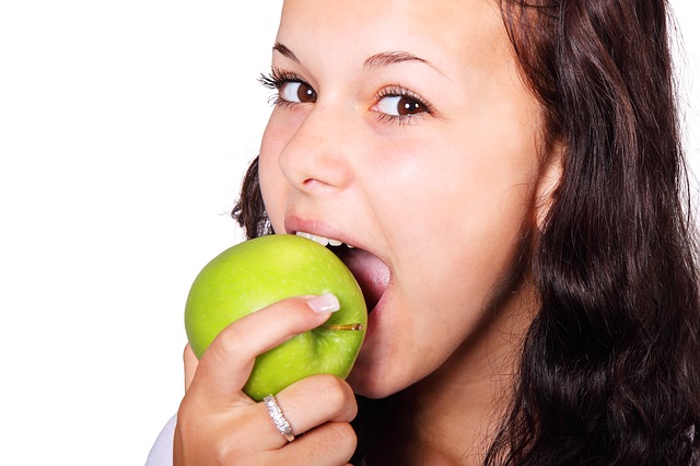 a girl eating apple