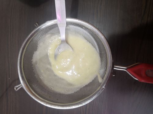 Sieving the banana paste