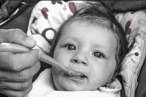 A baby being fed